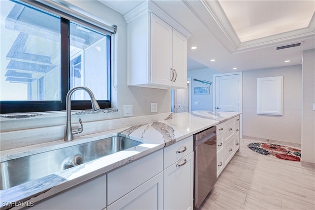 kitchen featuring dishwasher, white cabinets, a raised ceiling, sink, and light stone counters