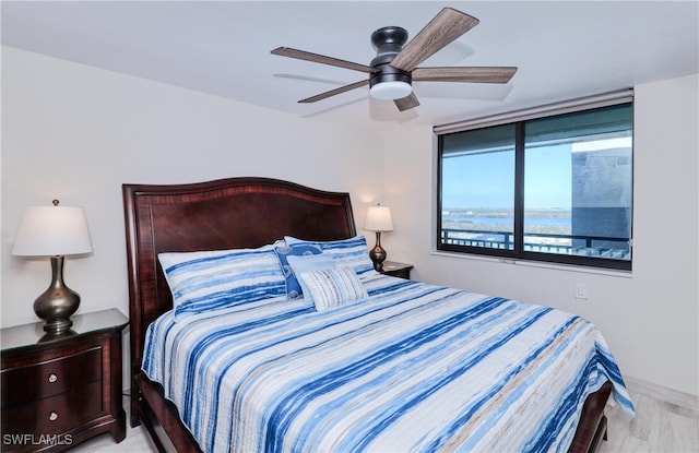 bedroom featuring ceiling fan and light hardwood / wood-style flooring