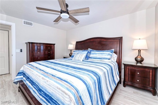 bedroom featuring ceiling fan and light wood-type flooring