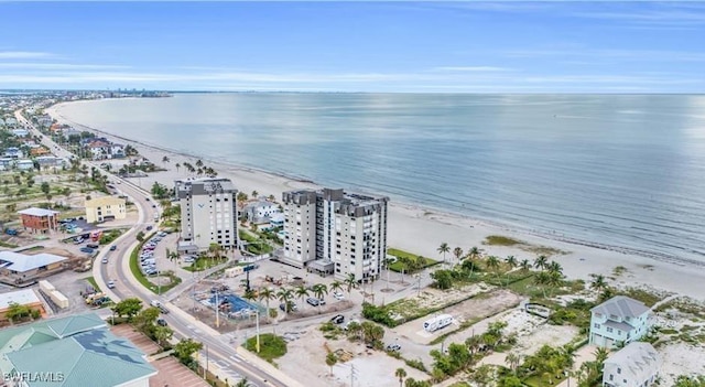 birds eye view of property featuring a water view and a view of the beach