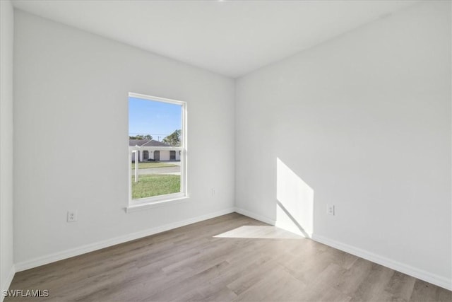 spare room with light wood-type flooring