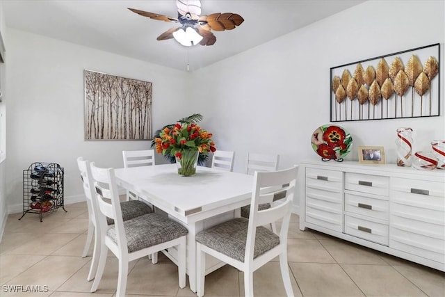 dining area featuring ceiling fan and light tile patterned floors