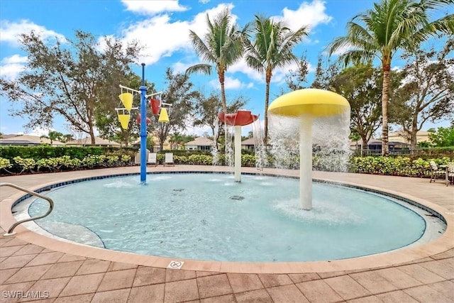 view of pool with pool water feature