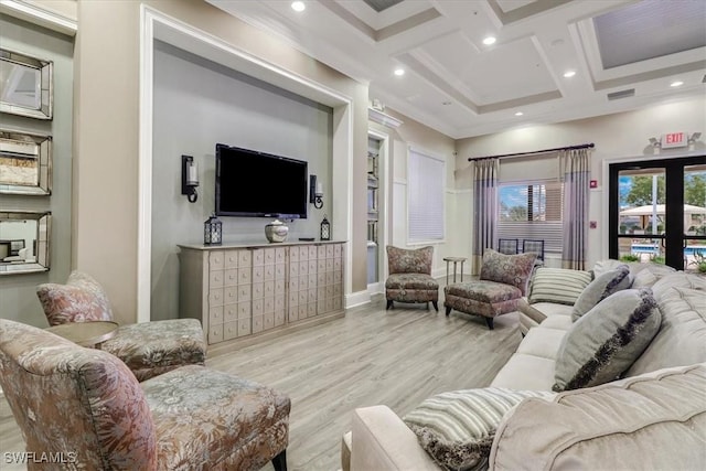 living room with beam ceiling, light wood-type flooring, ornamental molding, and coffered ceiling