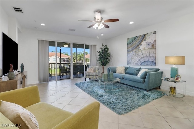 tiled living room with ceiling fan