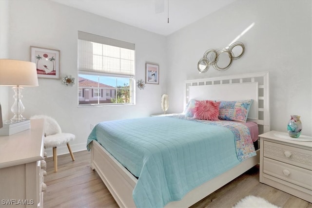 bedroom with ceiling fan and light wood-type flooring