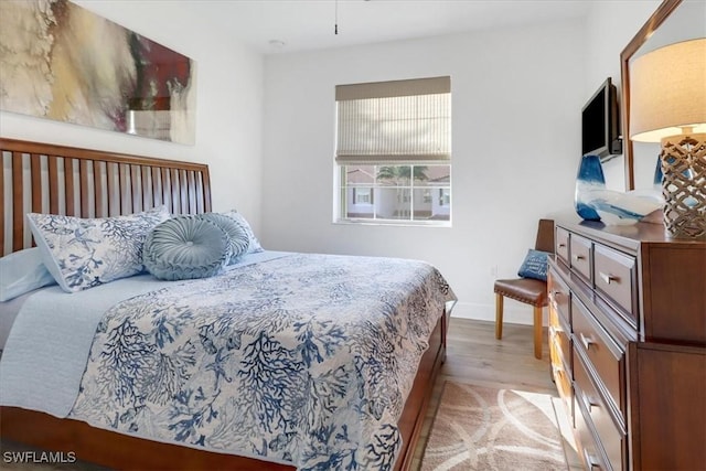 bedroom with light wood-type flooring