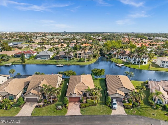 aerial view featuring a residential view and a water view