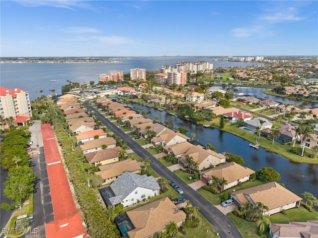 birds eye view of property featuring a water view and a residential view