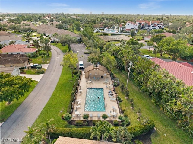 birds eye view of property with a residential view