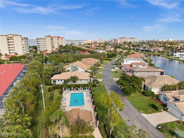 birds eye view of property with a water view