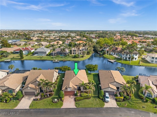 bird's eye view featuring a residential view and a water view