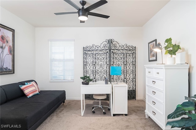 home office with ceiling fan and light colored carpet