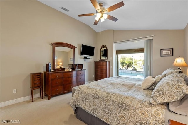 bedroom with ceiling fan, light colored carpet, and lofted ceiling