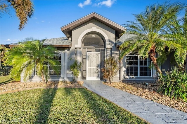 entrance to property with a yard