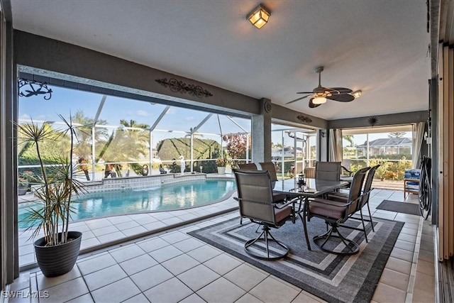 exterior space with ceiling fan, a healthy amount of sunlight, and a swimming pool