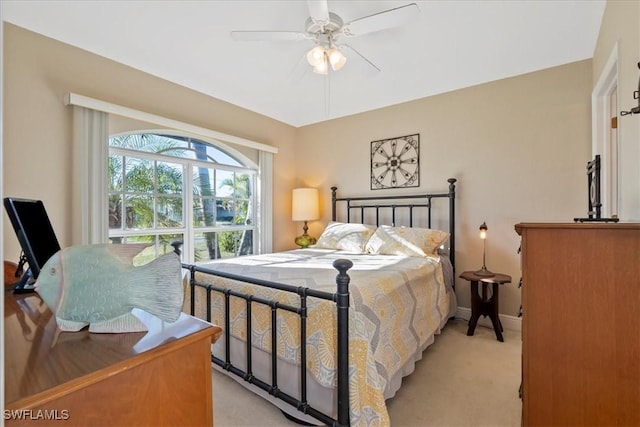 bedroom with light carpet and ceiling fan