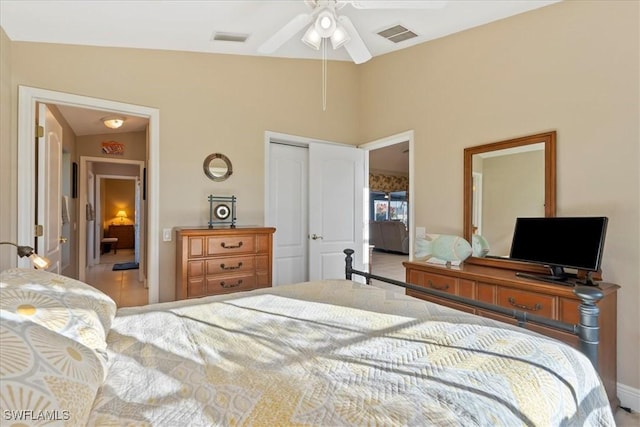 bedroom with ceiling fan, a closet, and vaulted ceiling