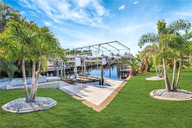 view of dock featuring a water view and a yard