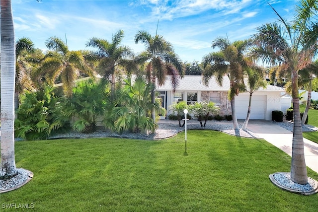 view of front facade with a front lawn and a garage