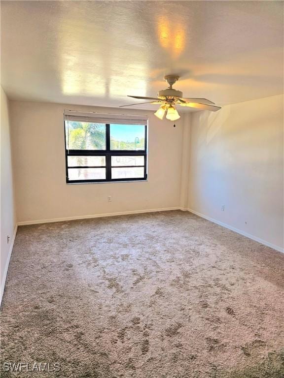 carpeted empty room with ceiling fan