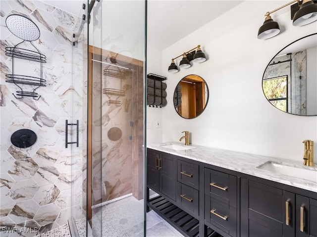 bathroom featuring vanity and a shower with shower door