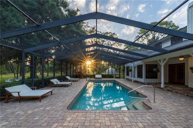 outdoor pool featuring a lanai, french doors, and a patio