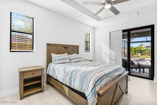 bedroom featuring access to outside, multiple windows, ceiling fan, and light hardwood / wood-style flooring