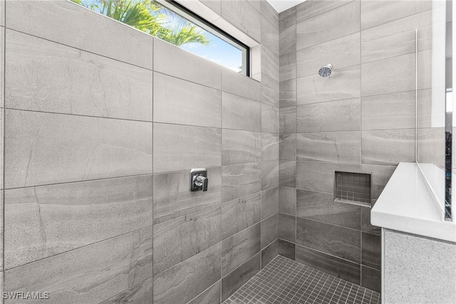 bathroom with a tile shower