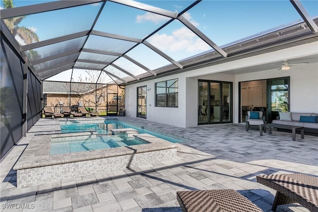 view of swimming pool featuring a lanai, ceiling fan, a patio, and an outdoor living space