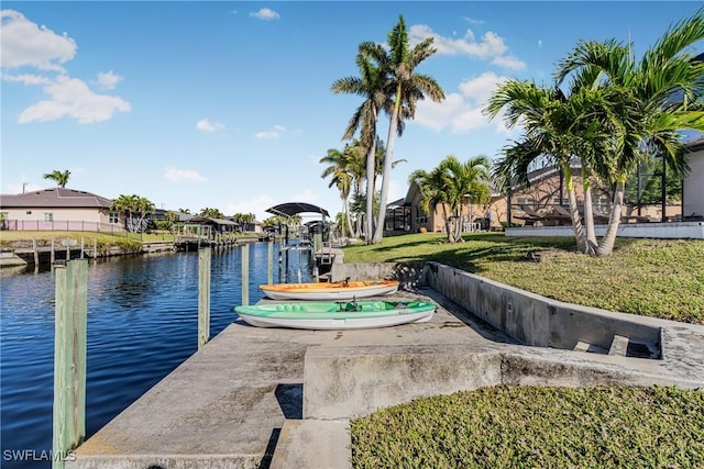 view of dock featuring a yard and a water view