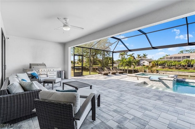 view of patio / terrace with an outdoor kitchen, an outdoor hangout area, ceiling fan, a swimming pool with hot tub, and a lanai