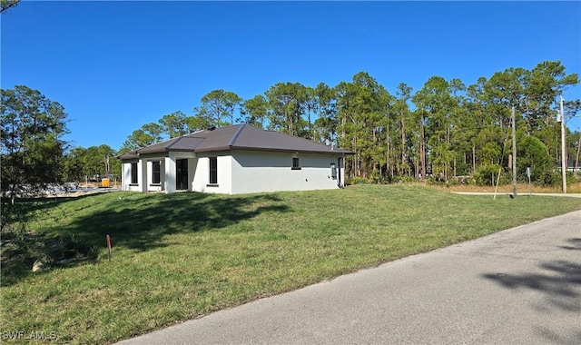 view of property exterior featuring a yard