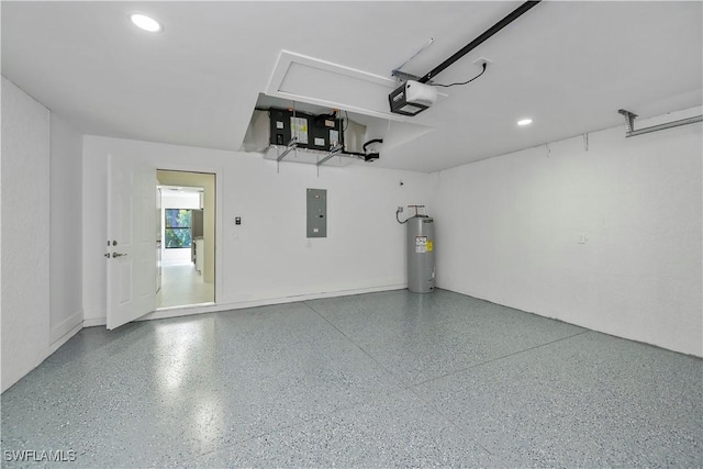 garage featuring electric panel, electric water heater, and a garage door opener