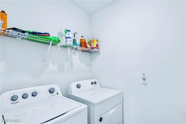 laundry room with independent washer and dryer