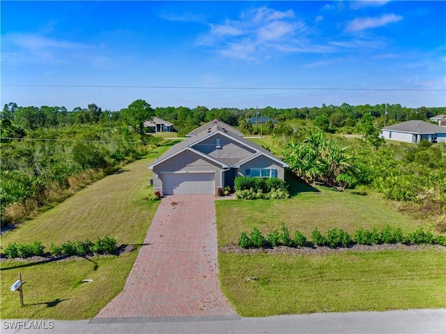 view of front facade featuring a front lawn and a garage