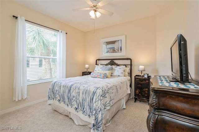 bedroom featuring light carpet and ceiling fan