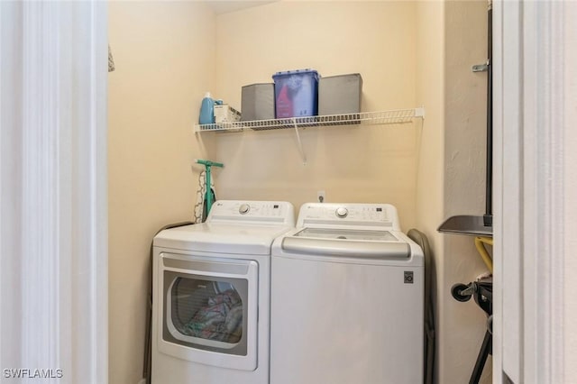 laundry room featuring washer and clothes dryer