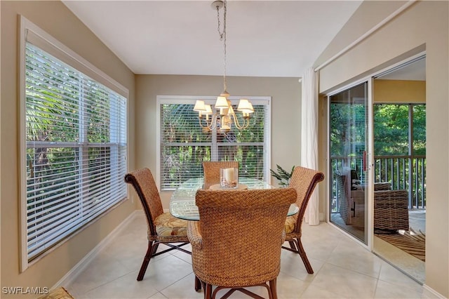 tiled dining area with a notable chandelier