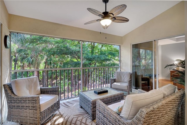 sunroom / solarium featuring ceiling fan and vaulted ceiling