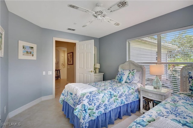 bedroom with light tile patterned floors and ceiling fan