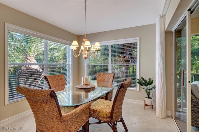 tiled dining room with a notable chandelier