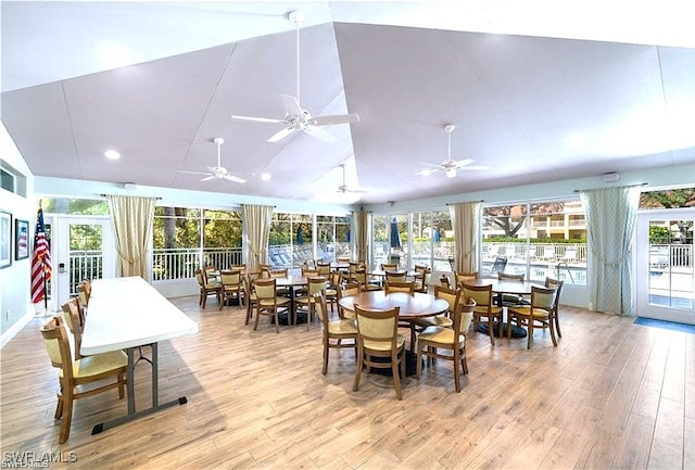 sunroom / solarium with ceiling fan and lofted ceiling