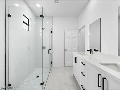 bathroom with vanity and an enclosed shower