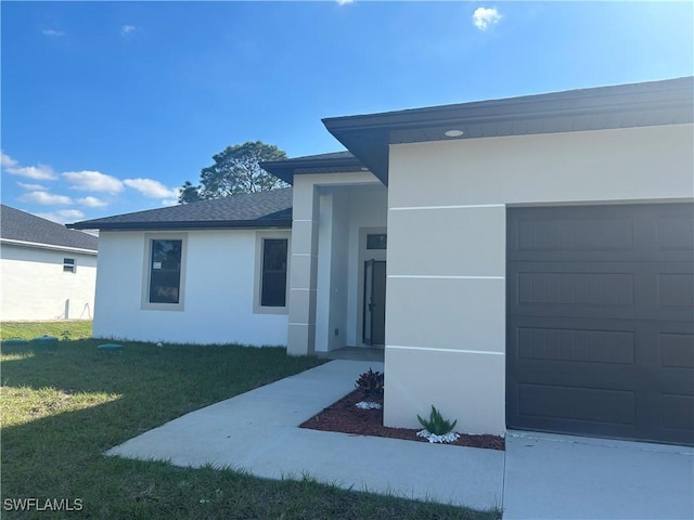 exterior space with a garage and a front yard