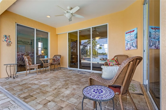 interior space featuring ceiling fan