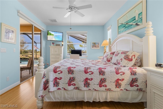 bedroom with access to outside, ceiling fan, and light wood-type flooring