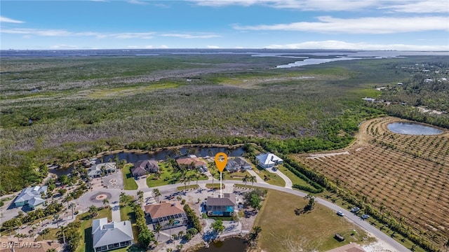 birds eye view of property featuring a rural view and a water view