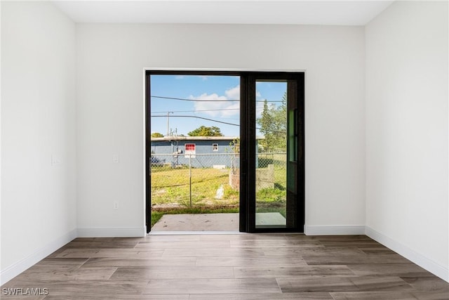 doorway to outside with light wood-type flooring