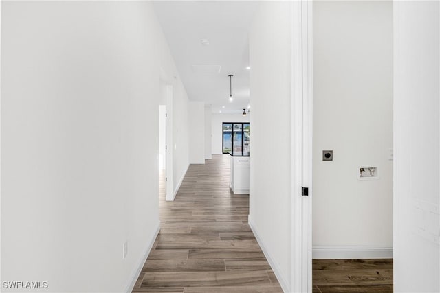 hall with light wood-type flooring